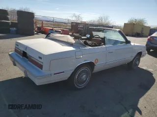 1982 Chrysler LeBaron z VIN 1C3BC55D3CG173312, wystawiony jako Copart lot #80800174 z przebiegiem 48 391 mil mil oraz Tytuł czysty. Historia ofert i sprzedaży dostępna na DreamBid. Obrazek 3.