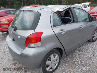 2010 Toyota Yaris with VIN JTDKT4K38A5296999, listed as a IAAI auction lot 41878127 with 122,692 mi miles. Bid and sale history available at carsss.com. Image 4.