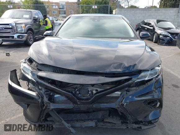 2018 Toyota Camry LE z VIN 4T1B11HK2JU002873, wystawiony jako IAAI lot #41637537 z przebiegiem 136 950 mil mil oraz . Historia ofert i sprzedaży dostępna na DreamBid. Obrazek 12.