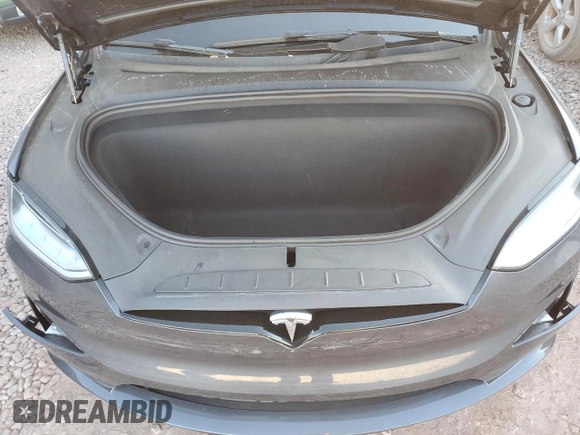 2023 Tesla Model X with VIN 7SAXCAE5XPF384061, listed as a Copart auction lot 86834084 with 6,974 mi miles and Salvage Title. Bid and sale history available at DreamBid. Image 14.