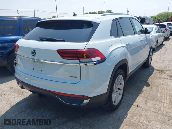 2022 Volkswagen Atlas SE z VIN 1V2HE2CA5NC225233, wystawiony jako IAAI lot #42366811 z przebiegiem 27 986 mil mil oraz . Historia ofert i sprzedaży dostępna na DreamBid. Obrazek 4.