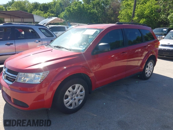 2015 Dodge Journey SE z VIN 3C4PDCAB5FT679585, wystawiony jako IAAI lot #42090600 z przebiegiem 166 876 mil mil oraz . Historia ofert i sprzedaży dostępna na DreamBid. Obrazek 2.