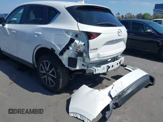 2018 Mazda CX-5 Touring with VIN JM3KFACM0J0416716, listed as a IAAI auction lot 42150121 with 61,332 mi miles and . Bid and sale history available at carsss.com. Image 6.