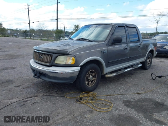 2003 Ford F-150 XLT with VIN 1FTRW07L13KA54535, listed as a IAAI auction lot 41766119 with 236,854 mi miles. Bid and sale history available at carsss.com. Image 2.