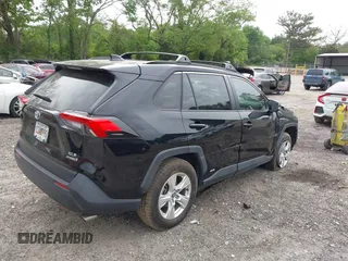 2021 Toyota RAV4 Hybrid XLE with VIN JTMRWRFV2MD133113, listed as a IAAI auction lot 42087394 with 103,019 mi miles and . Bid and sale history available at DreamBid. Image 4.