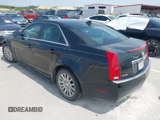 2013 Cadillac CTS Luxury with VIN 1G6DE5E50D0101763, listed as a IAAI auction lot 42090577 with 105,097 mi miles and . Bid and sale history available at DreamBid. Image 3.