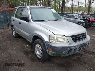 2001 Honda CR-V LX with VIN JHLRD28441C000682, listed as a IAAI auction lot 42019317 with 214,884 mi miles. Bid and sale history available at carsss.com. Image 1.