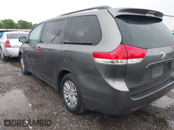 2014 Toyota Sienna XLE with VIN 5TDYK3DC0ES502482, listed as a IAAI auction lot 41910683 with 151,330 mi miles. Bid and sale history available at carsss.com. Image 3.