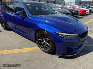 2018 BMW M3 with VIN WBS8M9C59J5L71951, listed as a IAAI auction lot 42129203 with 50,011 mi miles. Bid and sale history available at carsss.com. Image 1.
