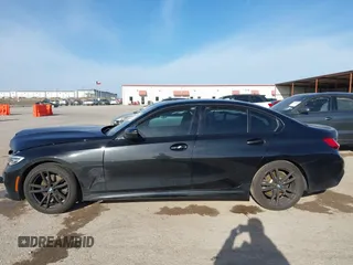 2021 BMW 3 Series 330i z VIN 3MW5R1J05M8B84800, wystawiony jako IAAI lot #41818906 z przebiegiem Nie podano mil oraz . Historia ofert i sprzedaży dostępna na DreamBid. Obrazek 14.