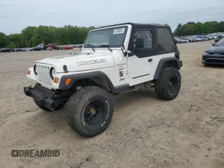 1999 Jeep Wrangler Sport z VIN 1J4FY19SXXP467533, wystawiony jako Copart lot #54393895 z przebiegiem 162 116 mil mil oraz Czysty tytuł • Clean title. Historia ofert i sprzedaży dostępna na DreamBid. Obrazek 1.