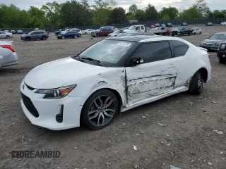 2014 Scion tC z VIN JTKJF5C70E3084411, wystawiony jako Copart lot #54255385 z przebiegiem 152 715 mil mil oraz Szkody całkowita. Historia ofert i sprzedaży dostępna na DreamBid. Obrazek 1.