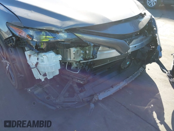 2022 Toyota Camry SE with VIN 4T1T11AKXNU683921, listed as a IAAI auction lot 41667833 with 26,578 mi miles and . Bid and sale history available at DreamBid. Image 6.