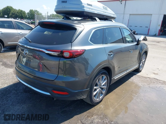 2022 Mazda CX-9 Grand Touring with VIN JM3TCBDY4N0618680, listed as a IAAI auction lot 40086806 with 34,142 mi miles and . Bid and sale history available at DreamBid. Image 4.