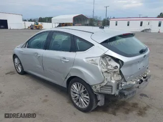 2015 Ford Focus Titanium with VIN 1FADP3N27FL228549, listed as a IAAI auction lot 41912941 with 69,025 mi miles. Bid and sale history available at carsss.com. Image 3.