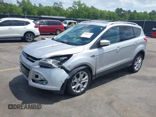 2014 Ford Escape Titanium with VIN 1FMCU0JX7EUA28824, listed as a IAAI auction lot 42065325 with 107,761 mi miles. Bid and sale history available at carsss.com. Image 2.