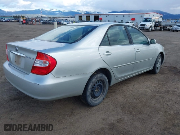 2004 Toyota Camry LE with VIN JTDBE32K640257695, listed as a IAAI auction lot 41837872 with 214,917 mi miles. Bid and sale history available at carsss.com. Image 4.