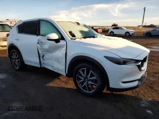 2018 Mazda CX-5 Grand Touring with VIN JM3KFBDM7J0370662, listed as a Copart auction lot 48602585 with 67,875 mi miles and Salvage Title. Bid and sale history available at DreamBid. Image 4.