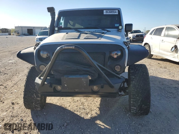 2009 Jeep Wrangler Rubicon with VIN 1J8GA64159L700909, listed as a Copart auction lot 86308954 with 138,065 mi miles and Salvage title. Bid and sale history available at DreamBid. Image 5.