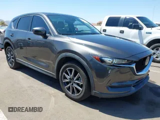 2018 Mazda CX-5 Touring with VIN JM3KFACM7J1338316, listed as a IAAI auction lot 42014879 with 71,407 mi miles. Bid and sale history available at carsss.com. Image 1.