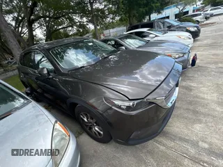 2016 Mazda CX-9 Touring z VIN JM3TCACY7G0115773, wystawiony jako Copart lot #60667065 z przebiegiem 119 432 mil mil oraz Czysty tytuł • Clean title. Historia ofert i sprzedaży dostępna na DreamBid. Obrazek 1.