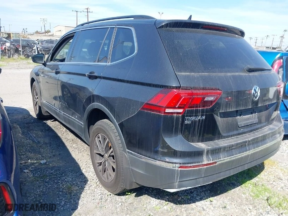 2021 Volkswagen Tiguan SE with VIN 3VV3B7AX0MM129887, listed as a IAAI auction lot 40565638 with 84,790 mi miles. Bid and sale history available at carsss.com. Image 3.