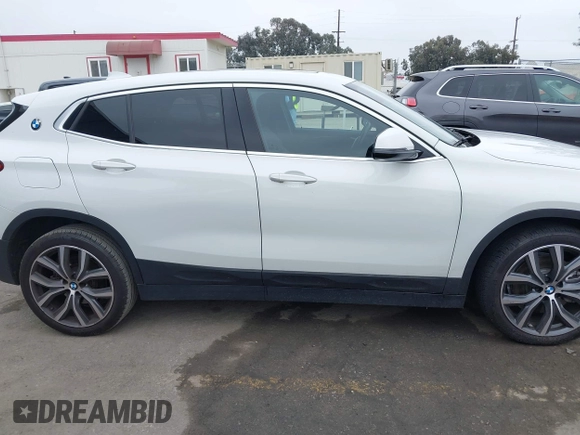 2022 BMW X2 sDrive28i z VIN WBXYH9C06N5U37719, wystawiony jako IAAI lot #42355050 z przebiegiem 33 127 mil mil oraz . Historia ofert i sprzedaży dostępna na DreamBid. Obrazek 12.
