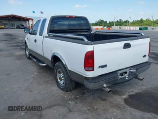 2002 Ford F-150 XL with VIN 1FTRX17242NA69697, listed as a IAAI auction lot 42038258 with 207,008 mi miles. Bid and sale history available at carsss.com. Image 3.