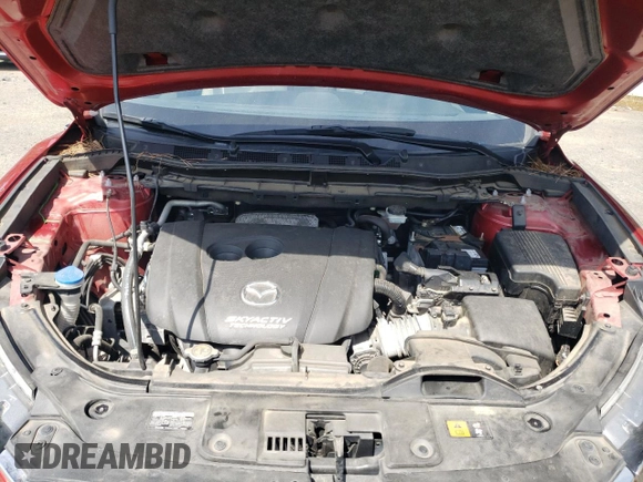 2016 Mazda CX-5 Grand Touring z VIN JM3KE2DY0G0722334, wystawiony jako Copart lot #59998185 z przebiegiem 51 449 mil mil oraz Szkoda całkowita • Salvage title. Historia ofert i sprzedaży dostępna na DreamBid. Obrazek 12.