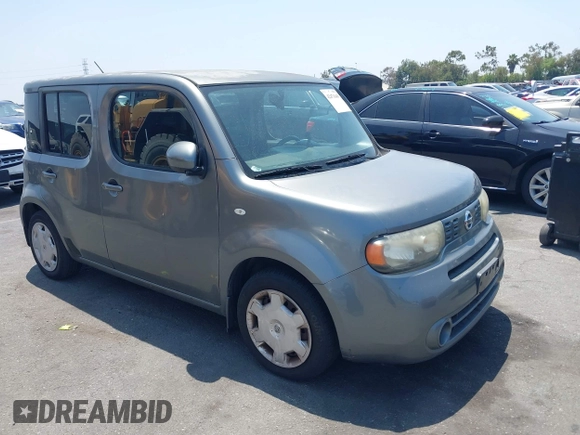 2011 Nissan Cube S z VIN JN8AZ2KR0BT213764, wystawiony jako IAAI lot #42471649 z przebiegiem 180 669 mil mil oraz . Historia ofert i sprzedaży dostępna na DreamBid. Obrazek 1.