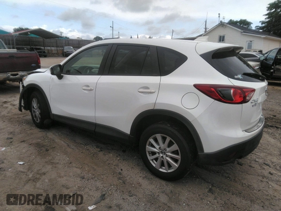 2014 Mazda CX-5 Touring z VIN JM3KE4CY0E0303748, wystawiony jako IAAI lot #42127406 z przebiegiem Nie podano mil oraz . Historia ofert i sprzedaży dostępna na DreamBid. Obrazek 3.