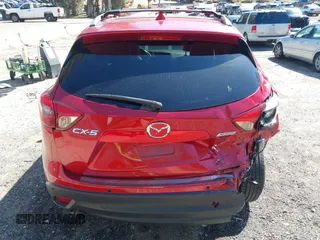 2016 Mazda CX-5 Grand Touring with VIN JM3KE2DY3G0686588, listed as a IAAI auction lot 41697312 with 65,090 mi miles. Bid and sale history available at carsss.com. Image 16.