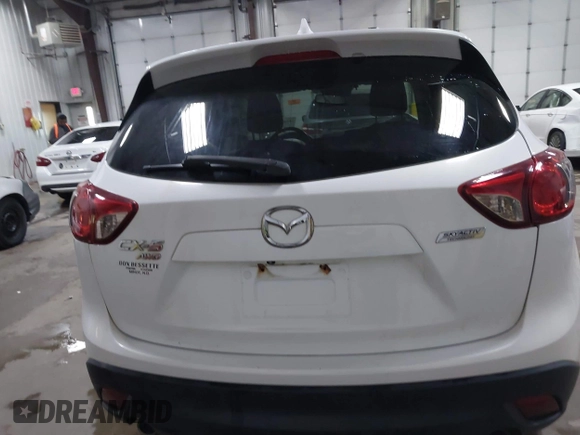 2014 Mazda CX-5 Touring with VIN JM3KE4CY4E0349034, listed as a IAAI auction lot 41478954 with 117,502 mi miles. Bid and sale history available at carsss.com. Image 16.