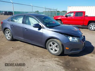 2014 Chevrolet Cruze 1LT with VIN 1G1PC5SB9E7353636, listed as a IAAI auction lot 41310506 with 155,901 mi miles and . Bid and sale history available at DreamBid. Image 1.