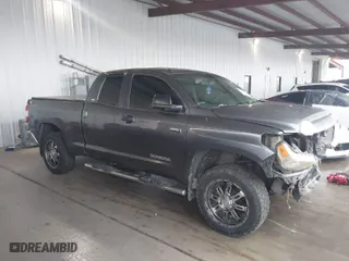 2014 Toyota Tundra 2WD Truck SR with VIN 5TFRY5F15EX166929, listed as a IAAI auction lot 41458810 with 142,152 mi miles. Bid and sale history available at carsss.com. Image 13.