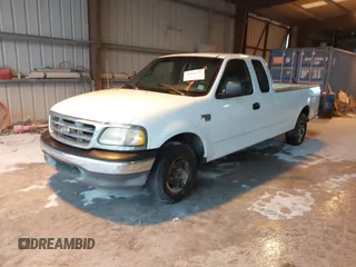 2002 Ford F-150 XL with VIN 1FTRX17L52NA38404, listed as a IAAI auction lot 41871731 with 366,564 mi miles. Bid and sale history available at carsss.com. Image 2.