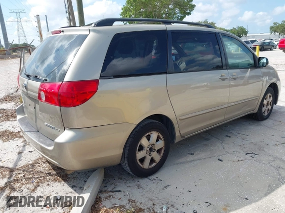 2009 Toyota Sienna CE with VIN 5TDZK23C09S251520, listed as a IAAI auction lot 42155604 with 233,153 mi miles. Bid and sale history available at carsss.com. Image 4.
