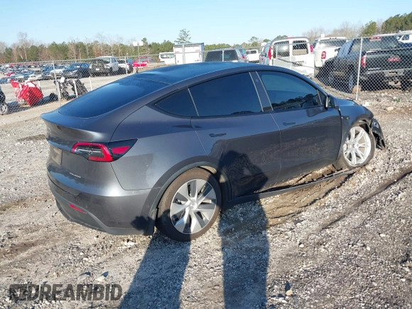 2022 Tesla Model Y Long Range with VIN 7SAYGAEE6NF361883, listed as a IAAI auction lot 41752441 with 50,493 mi miles and . Bid and sale history available at DreamBid. Image 4.