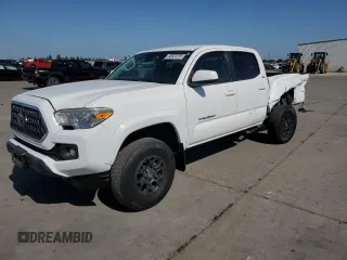 2018 Toyota Tacoma SR5 with VIN 3TMBZ5DN7JM014784, listed as a Copart auction lot 55620295 with 69,331 mi miles and Salvage title. Bid and sale history available at DreamBid. Image 1.