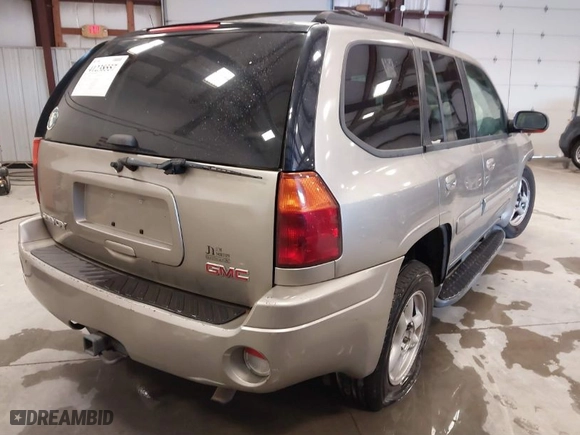 2003 GMC Envoy SLT with VIN 1GKDS13S932299354, listed as a IAAI auction lot 41238557 with 251,535 mi miles. Bid and sale history available at carsss.com. Image 4.