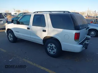 2004 Chevrolet Blazer LS z VIN 1GNDT13X34K161001, wystawiony jako IAAI lot #41432856 z przebiegiem Nie podano mil oraz . Historia ofert i sprzedaży dostępna na DreamBid. Obrazek 3.