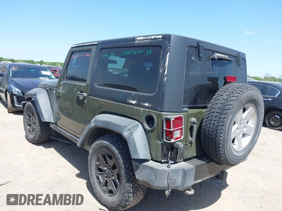 2015 Jeep Wrangler Sport with VIN 1C4AJWAGXFL650428, listed as a IAAI auction lot 42010629 with 80,039 mi miles. Bid and sale history available at carsss.com. Image 3.