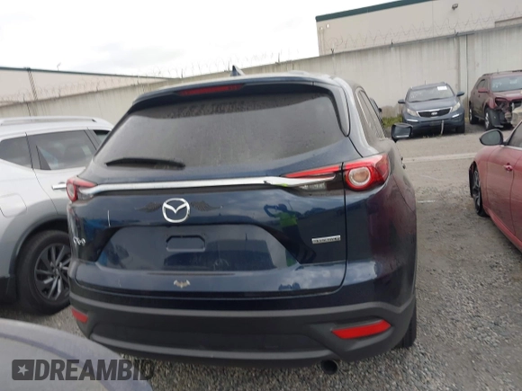 2021 Mazda CX-9 Touring with VIN JM3TCACY9M0526880, listed as a IAAI auction lot 42310923 with 25,991 mi miles and . Bid and sale history available at DreamBid. Image 17.