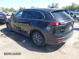 2020 Mazda CX-9 Sport with VIN JM3TCABY8L0407430, listed as a IAAI auction lot 42288490 with 50,317 mi miles and . Bid and sale history available at DreamBid. Image 3.
