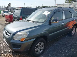 2009 Kia Sportage LX with VIN KNDJE723197563651, listed as a IAAI auction lot 41477610 with 168,797 mi miles and . Bid and sale history available at carsss.com. Image 2.