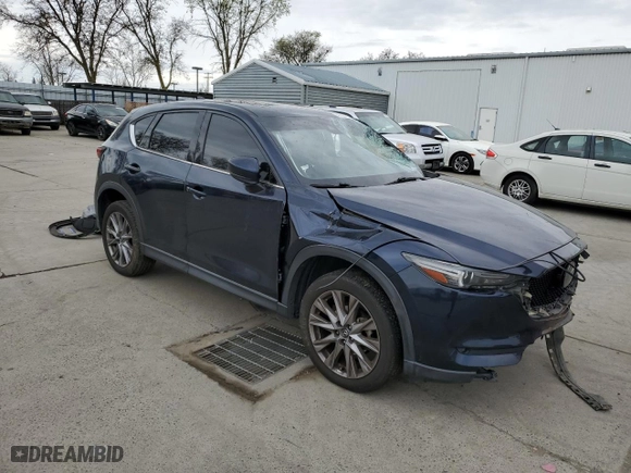 2021 Mazda CX-5 Grand Touring with VIN JM3KFADM8M1321415, listed as a Copart auction lot 47685415 with 90,145 mi miles and Salvage Title. Bid and sale history available at carsss.com. Image 4.