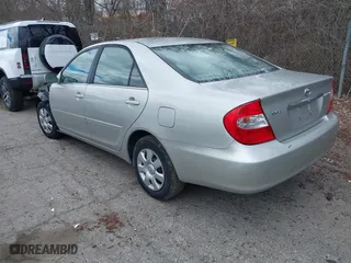 2003 Toyota Camry LE with VIN 4T1BE32K13U784854, listed as a IAAI auction lot 42039285 with 208,776 mi miles. Bid and sale history available at carsss.com. Image 3.