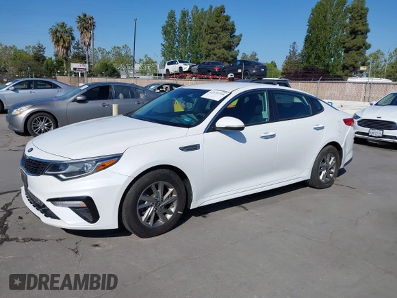 2019 Kia Optima LX with VIN 5XXGT4L33KG324175, listed as a IAAI auction lot 42139795 with 105,273 mi miles. Bid and sale history available at carsss.com. Image 2.