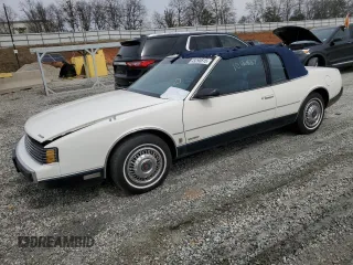 1987 Oldsmobile Toronado with VIN 1G3EZ1130HU307201, listed as a Copart auction lot 49290815 with 104,837 mi miles and Salvage Title. Bid and sale history available at DreamBid. Image 1.