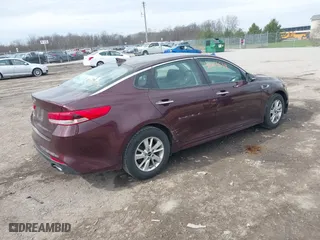 2016 Kia Optima LX with VIN 5XXGT4L36GG108599, listed as a IAAI auction lot 42065639 with 127,387 mi miles. Bid and sale history available at carsss.com. Image 4.